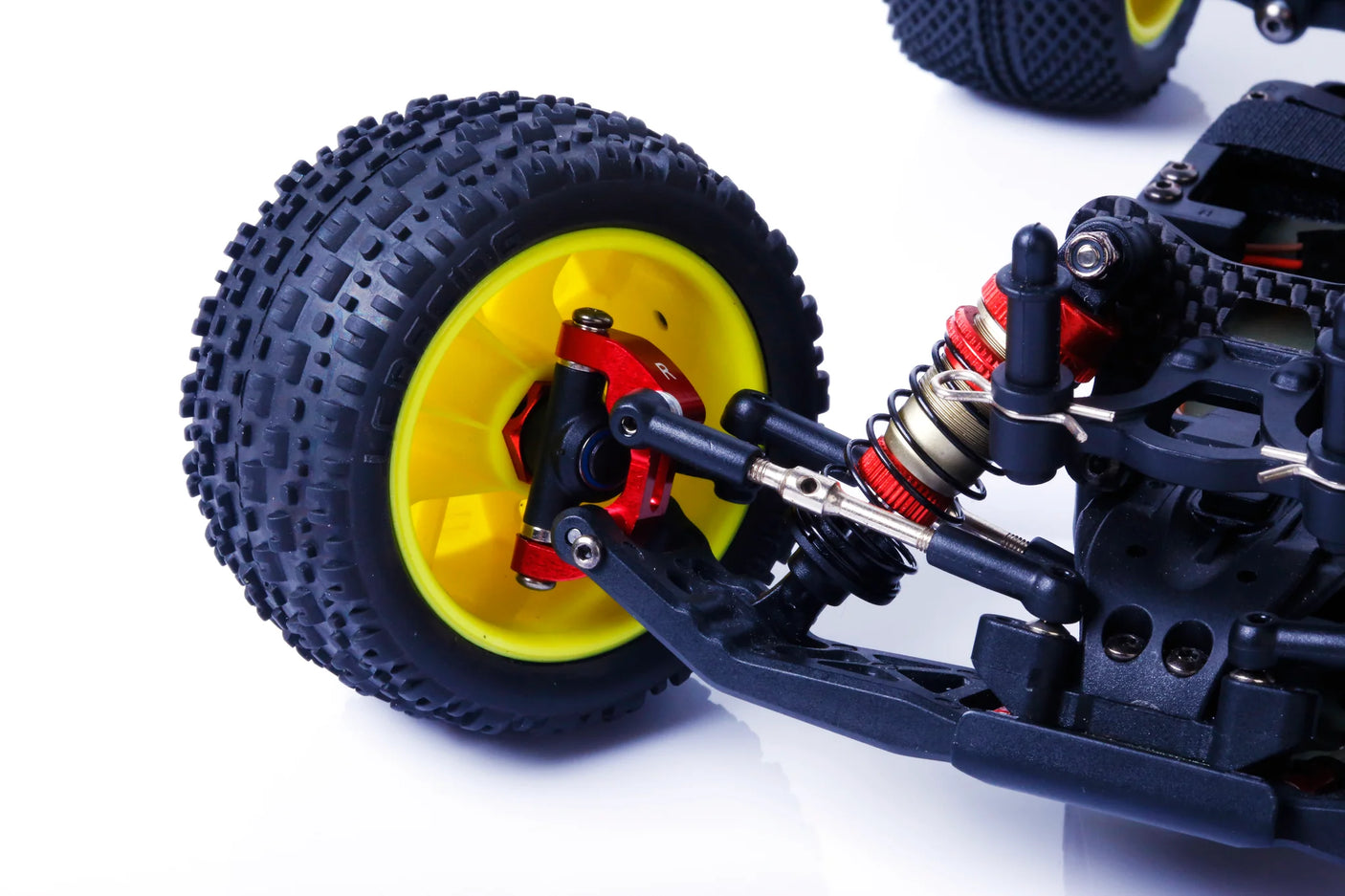 LC Racing L5069 aluminum caster blocks V2 installed on RC car, showcasing durable, precision-machined suspension components.
