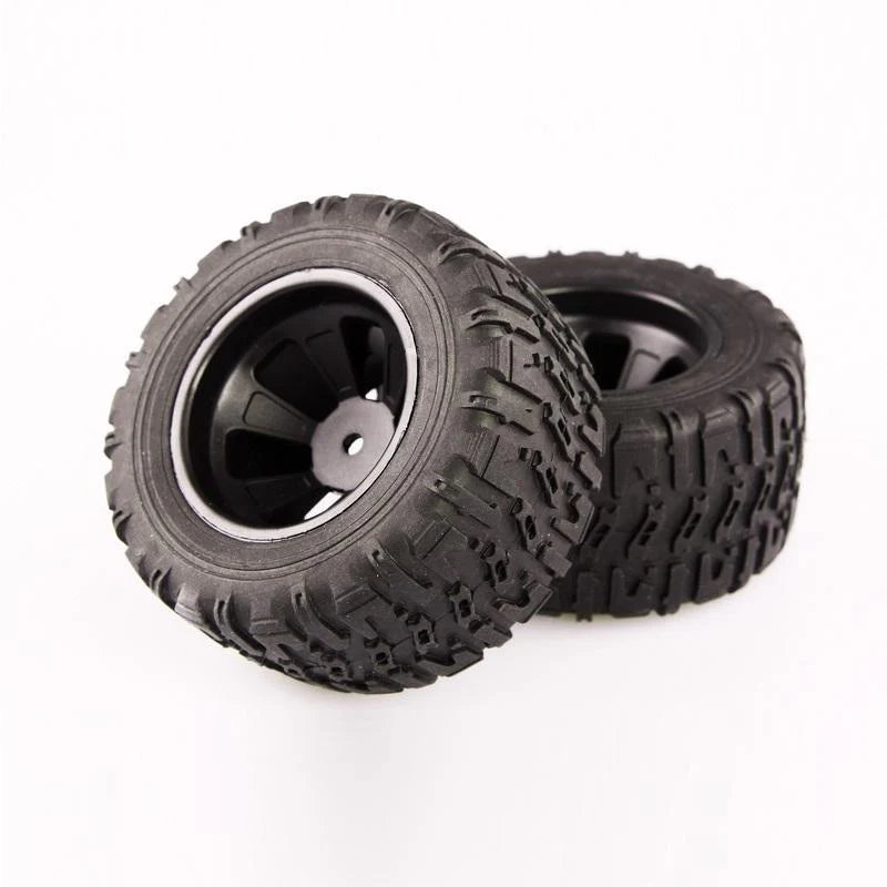 Pair of LC Racing L6061 MT 12mm mounted tires set, showing treads and rubber surface for RC off-road vehicles.