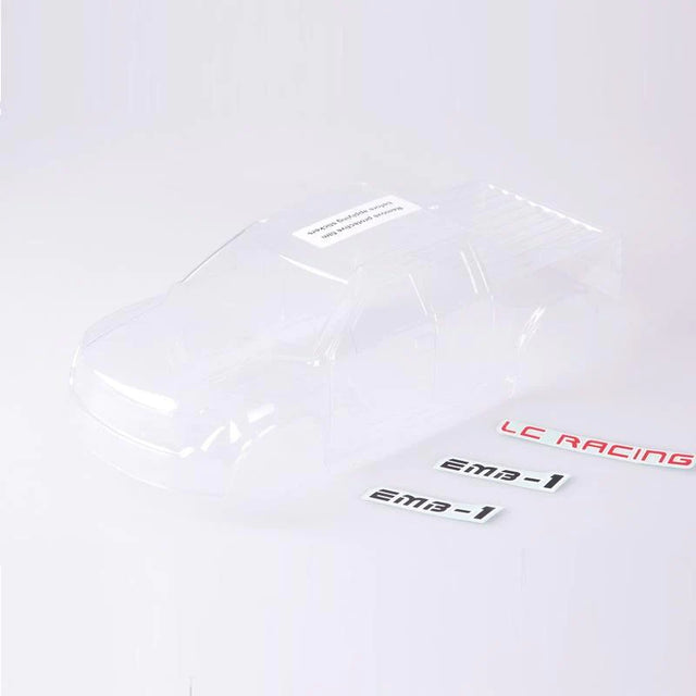 Clear polycarbonate body shell for LC Racing L6063 MT RC truck, shown from side angle with detailed contours.