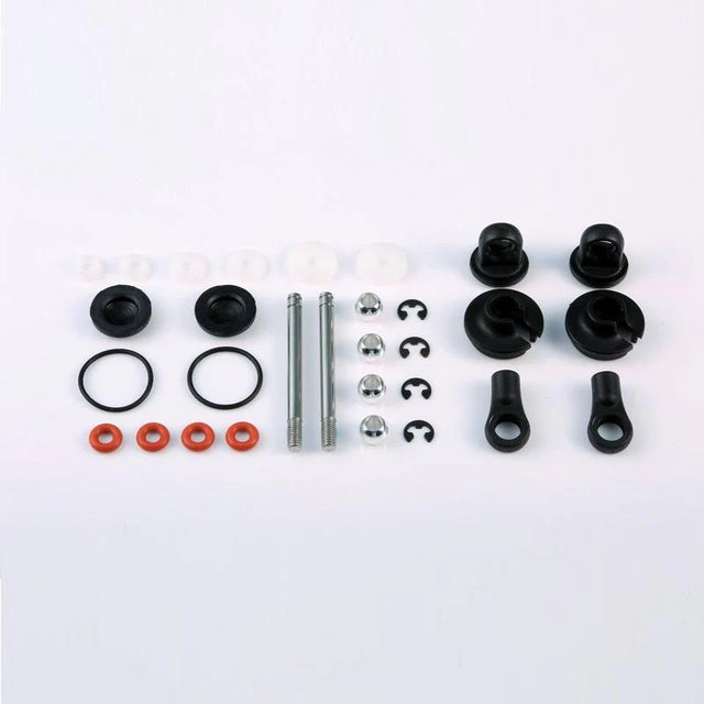 LC Racing L6115 rear shock accessories, close-up of black shock mounting hardware and adjustment components.