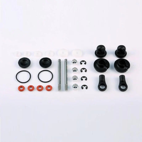 LC Racing L6121 front shock accessories, close-up of black shock parts with metallic fittings for RC vehicle suspension.
