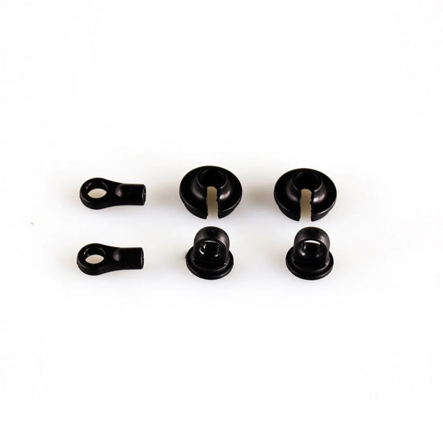 LC Racing L6187 shock caps, spring cups, and rod end set shown in a close-up image with detailed black and metal components.