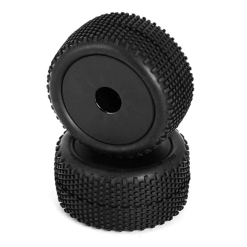 Pair of black LC Racing L6249 mounted block pin Truggy tires with tread pattern for off-road RC racing.
