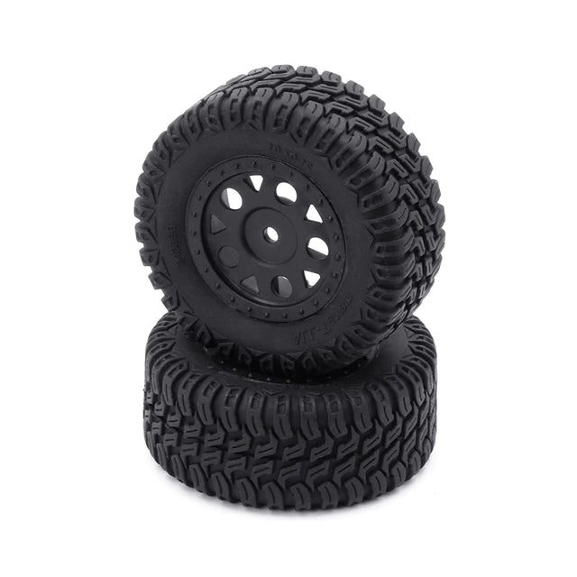 Pair of LC Racing L6268 short course truck tires with textured rubber treads and black sidewalls for off-road RC racing.