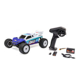 Losi 1/18 Mini-T 2.0 2S 2WD RTR brushless stadium truck on a track, showcasing its compact design and vibrant color scheme.