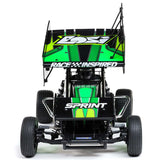 Losi 1/10 scale 22S Sprint 2WD RTR radio-controlled car on a track, showcasing its sleek design and vibrant orange body.