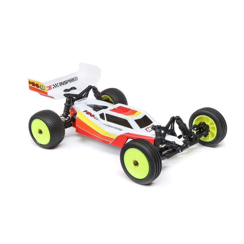 Losi 1/16 Mini-B 2WD RTR brushless buggy on a track, showcasing its compact design and detailed exterior.
