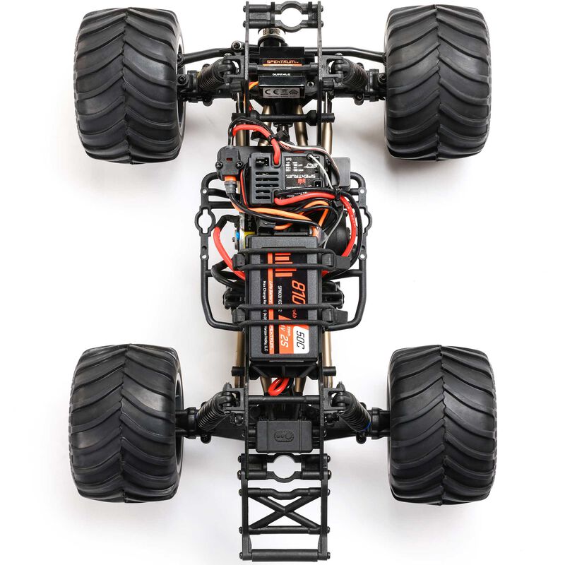 Losi 1/18 Mini LMT Megalodon 2S 4x4 RTR brushed monster truck on rugged terrain with detailed body and large tires