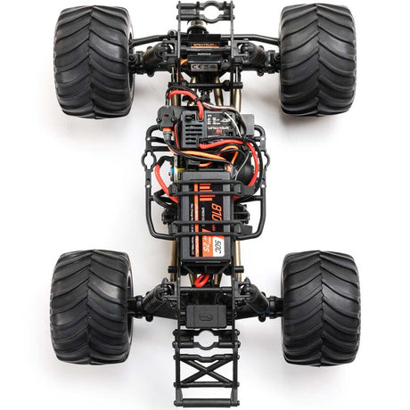 Losi 1/18 Mini LMT Megalodon 2S 4x4 RTR brushed monster truck on rugged terrain with detailed body and large tires
