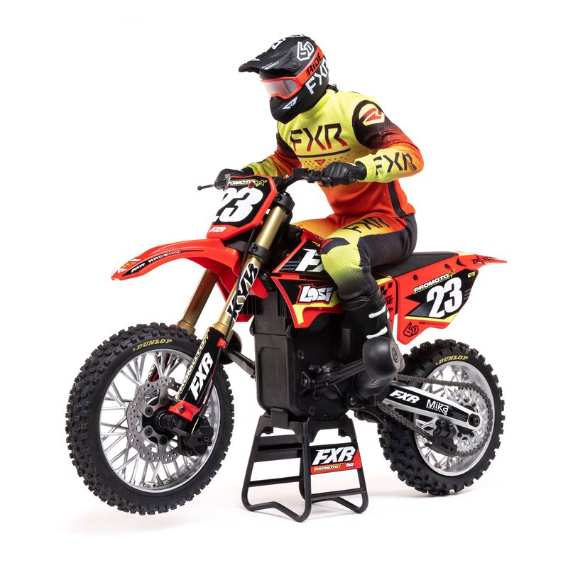 Red Losi 1/4 Promoto-MX FXR 2S RTR brushless motorcycle ready for off-road riding, featuring detailed design and realistic features.