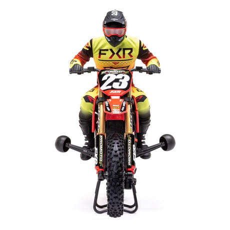 Red Losi 1/4 Promoto-MX FXR 2S RTR brushless motorcycle with detailed body and realistic design, ready for off-road riding.
