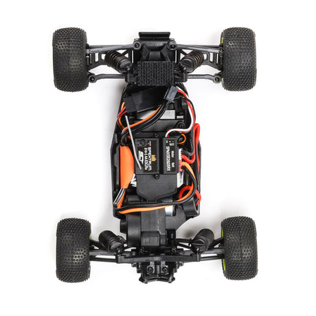 Losi Micro-T 2WD 1/28 scale truggy with orange and black body, detailed tires, and suspension visible in the image.
