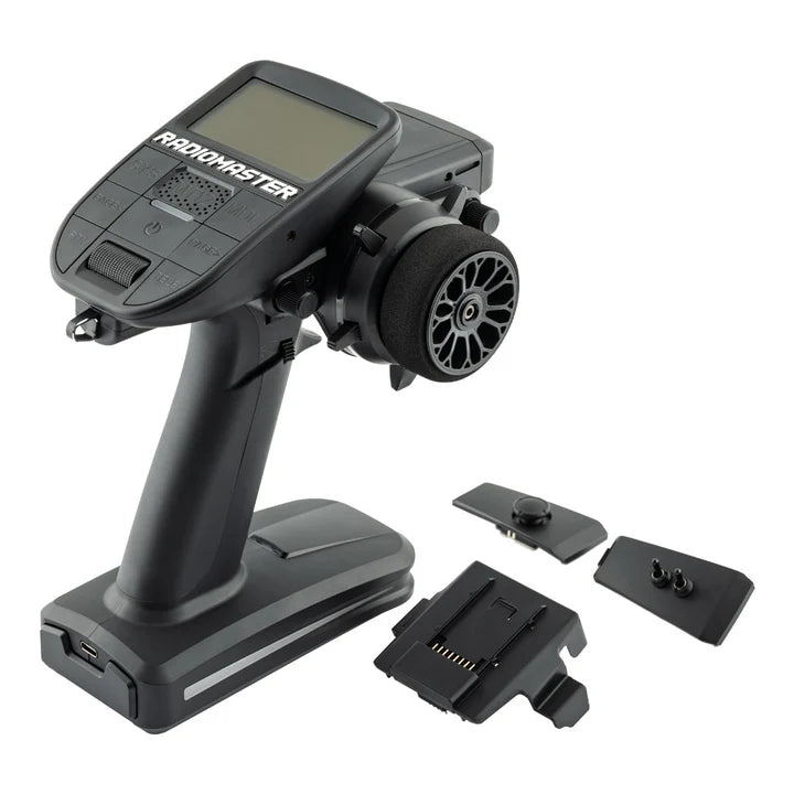 RadioMaster MT12 Surface Radio Controller with ergonomic grips, multiple control sticks, and a digital display for remote flying.