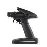 RadioMaster MT12 Surface Radio Controller with ergonomic grips, dual joysticks, and multiple control switches for RC drone flying.