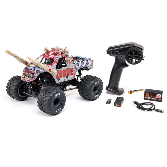 Losi 1/18 Mini LMT Zombie 2S 4x4 brushed monster truck on rough terrain, showcasing its compact off-road design and zombie-themed body.