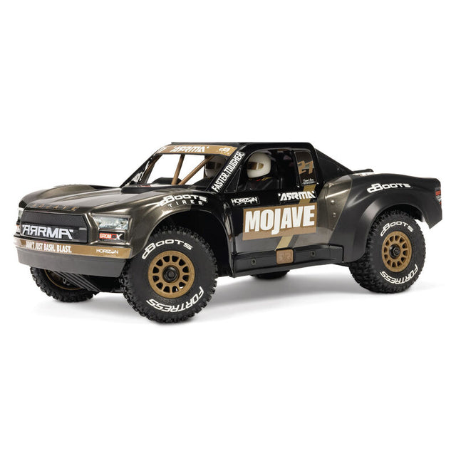ARRMA 1/16 Mojave GROM 223S DSC 4X4 RTR brushless desert truck in black, showcasing its rugged design and off-road tires.