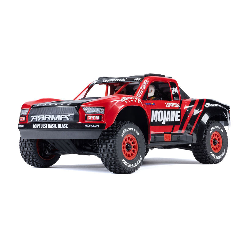ARRMA 1/16 Mojave GROM 4x4 RTR brushed desert truck showing off its rugged off-road design and detailed exterior features.