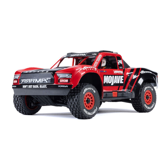 ARRMA 1/16 Mojave GROM 4x4 RTR brushed desert truck showing off its rugged off-road design and detailed exterior features.