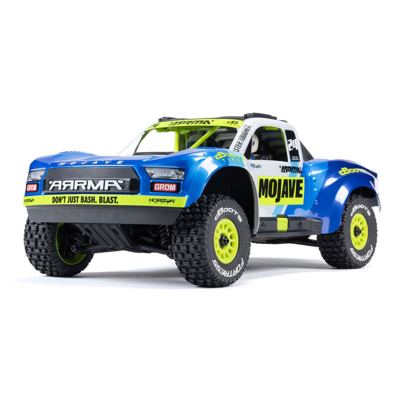 ARRMA 1/16 Mojave GROM 4x4 RTR brushed desert truck with detailed exterior and off-road tires.