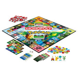 Hasbro Monopoly Pokemon board game with colorful Pokemon-themed tokens and game components visible on the game board.
