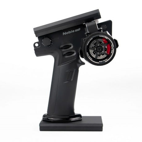 Flysky Noble NB4+ RC transmitter with FGr4B receiver, featuring a sleek design and multiple control sticks for remote drone or RC vehicle use.