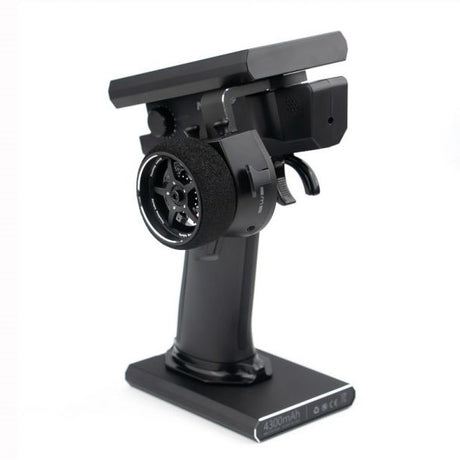 Flysky Noble NB4+ RC transmitter with FGr4B receiver, featuring a sleek black design and multiple control switches.