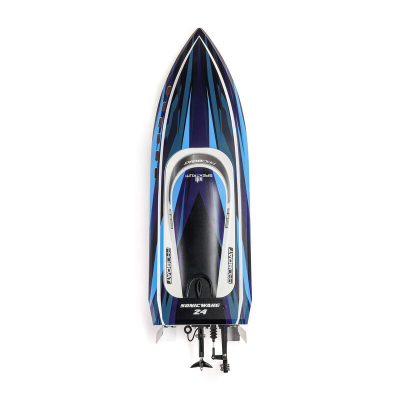 Proboat Sonicwake 24-inch remote control boat on water with battery and charger included, showcasing sleek design and vibrant colors.