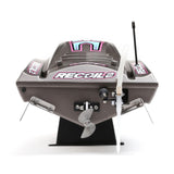 Proboat Heatwave Recoil 2 V2 26-inch self-righting RC boat on water, featuring bright colors and sleek design
