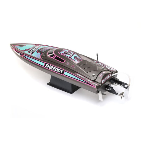 Proboat Heatwave Recoil 2 V2 26-inch self-righting boat with sleek design and vibrant colors floating on water.
