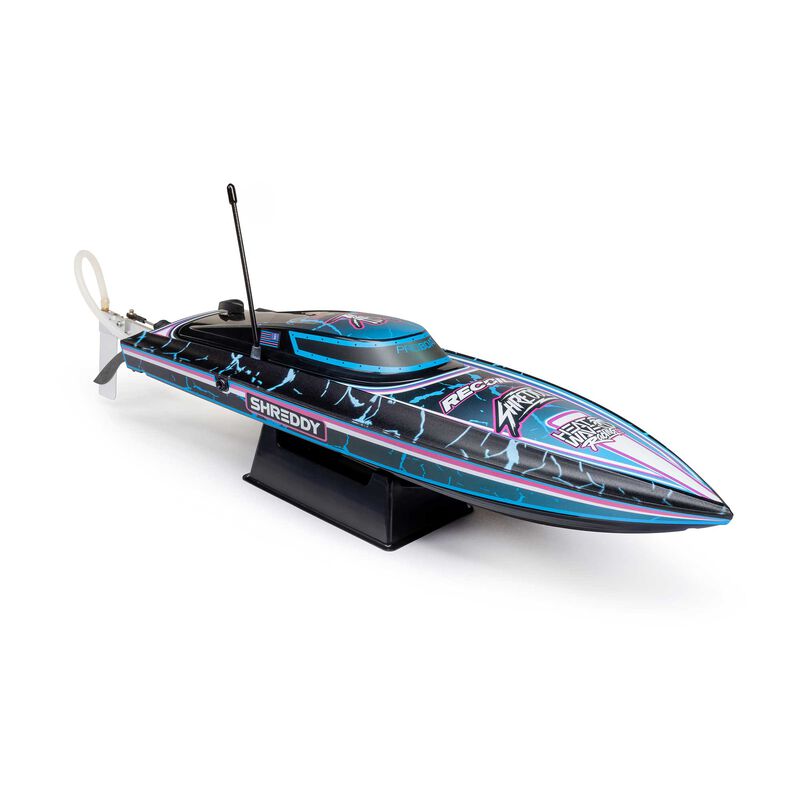 Proboat Recoil 2 18-inch self-righting brushless deep-V RC boat on water, showing sleek design and vibrant color scheme.