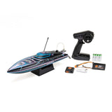 Proboat Recoil 2 18-inch self-righting brushless deep-V RC boat on water with remote control in background
