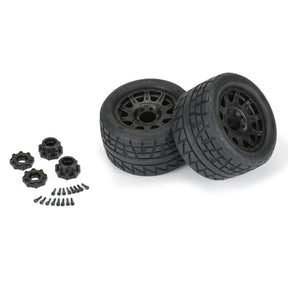 Two Proline Menace HP belted 3.8-inch mounted tires for RC trucks, shown mounted on wheels in a close-up view.
