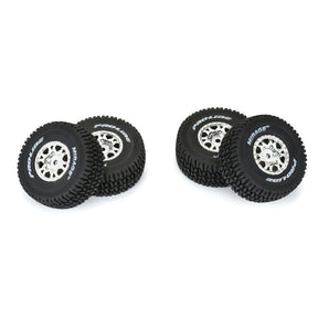 Set of four Proline Mirage TT satin silver mounted tires for Mojave GROM remote control truck, featuring detailed tread pattern.