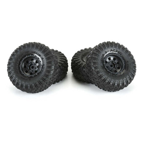 Proline 1/30 Aztek front and rear mounted black Clobber tires for SCX30 radio control truck.