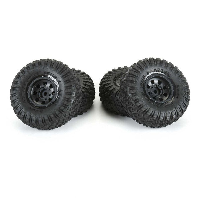 Proline 1/30 Aztek front and rear mounted black Clobber tires for SCX30 radio control truck.