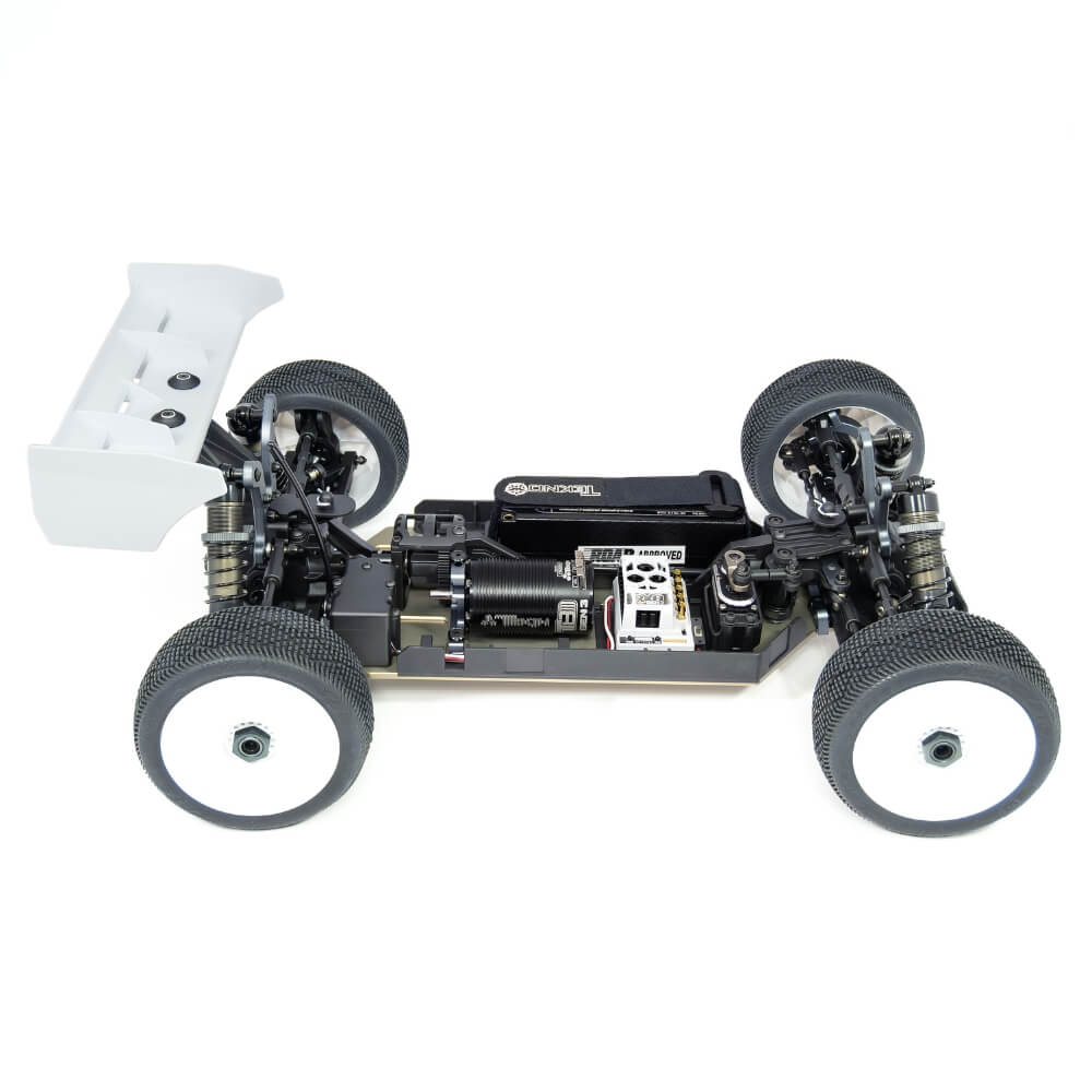 Passenger-side view of Tekno EB48 2.2 1/8th scale 4WD electric buggy kit with body removed, showing chassis and internal components.