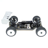 Passenger-side view of Tekno EB48 2.2 1/8th scale 4WD electric buggy kit with body removed, showing chassis and internal components.