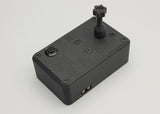 Reflex Racing RRE011 tire gluing machine for 1:28 scale RC cars, shown with parts and tools for precise tire assembly.