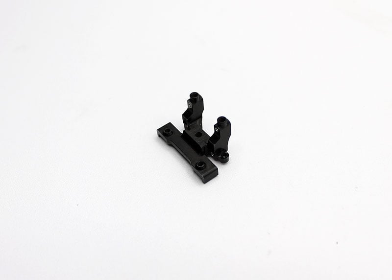 Reflex Racing RX28-020 G2 aluminum front bulkhead for RC car, showcasing precision-machined metal component and mounting points.
