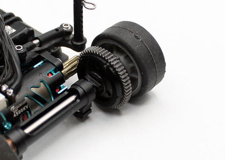 Reflex Racing RX28A-30 V3 spur gear and ball diff aluminum dust covers on a RC car component, showing protective covers and gear details.