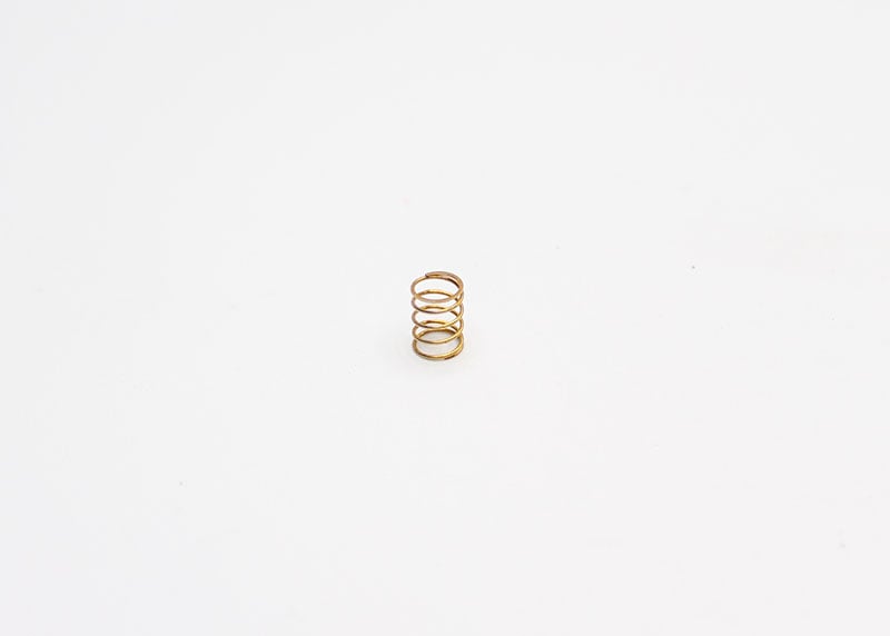 Reflex Racing RX28A-33-HS G2 gold hard center spring for RC cars, showing the coil spring with a gold finish.