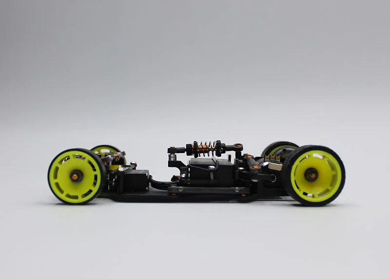 Reflex Racing RX28D Champions Edition 2WD RC car kit with detailed body and racing decals on a smooth surface.