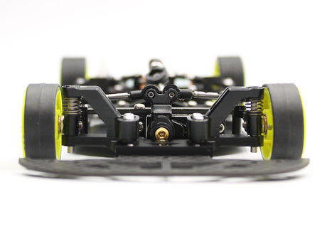 Reflex Racing RX28K 1/28 scale 2WD RC car kit Gen 2 on a track, showcasing its sleek design and detailed body.