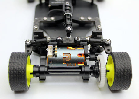 Reflex Racing RX28K 1/28 2WD RC car kit Gen 2 with sleek black and red body, detailed chassis, and racing wheels.
