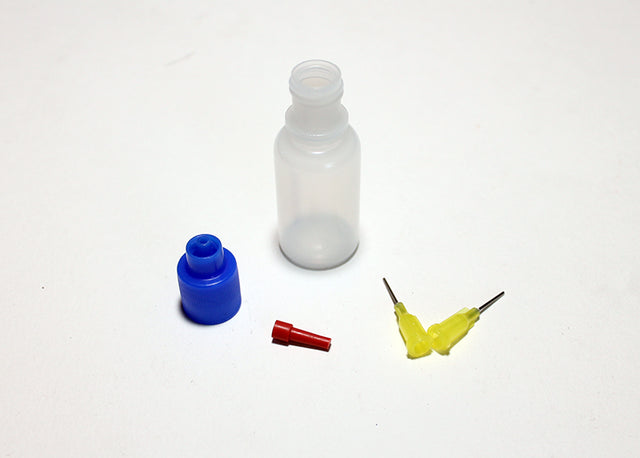 Reflex Racing RX400 tire glue bottle with precision tips for RC car tire assembly and maintenance.