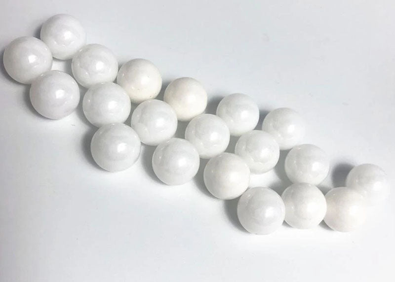 Reflex Racing RX409 2.381 zirconium oxide ceramic balls for RC car parts, showing smooth, spherical ceramic bearings.