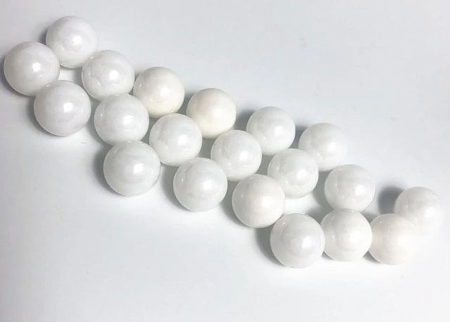 Reflex Racing RX409 2.381 zirconium oxide ceramic balls for RC car parts, showing smooth, spherical ceramic bearings.