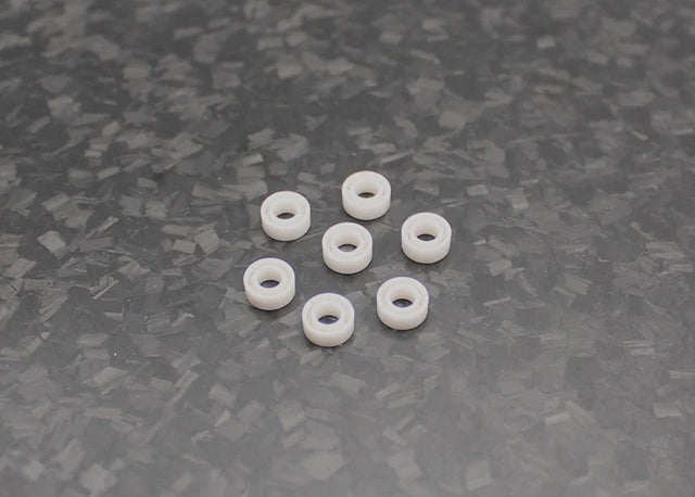 Reflex Racing RX542 full ceramic RC car bearing set with three 6x2.5mm bearings on a white background.