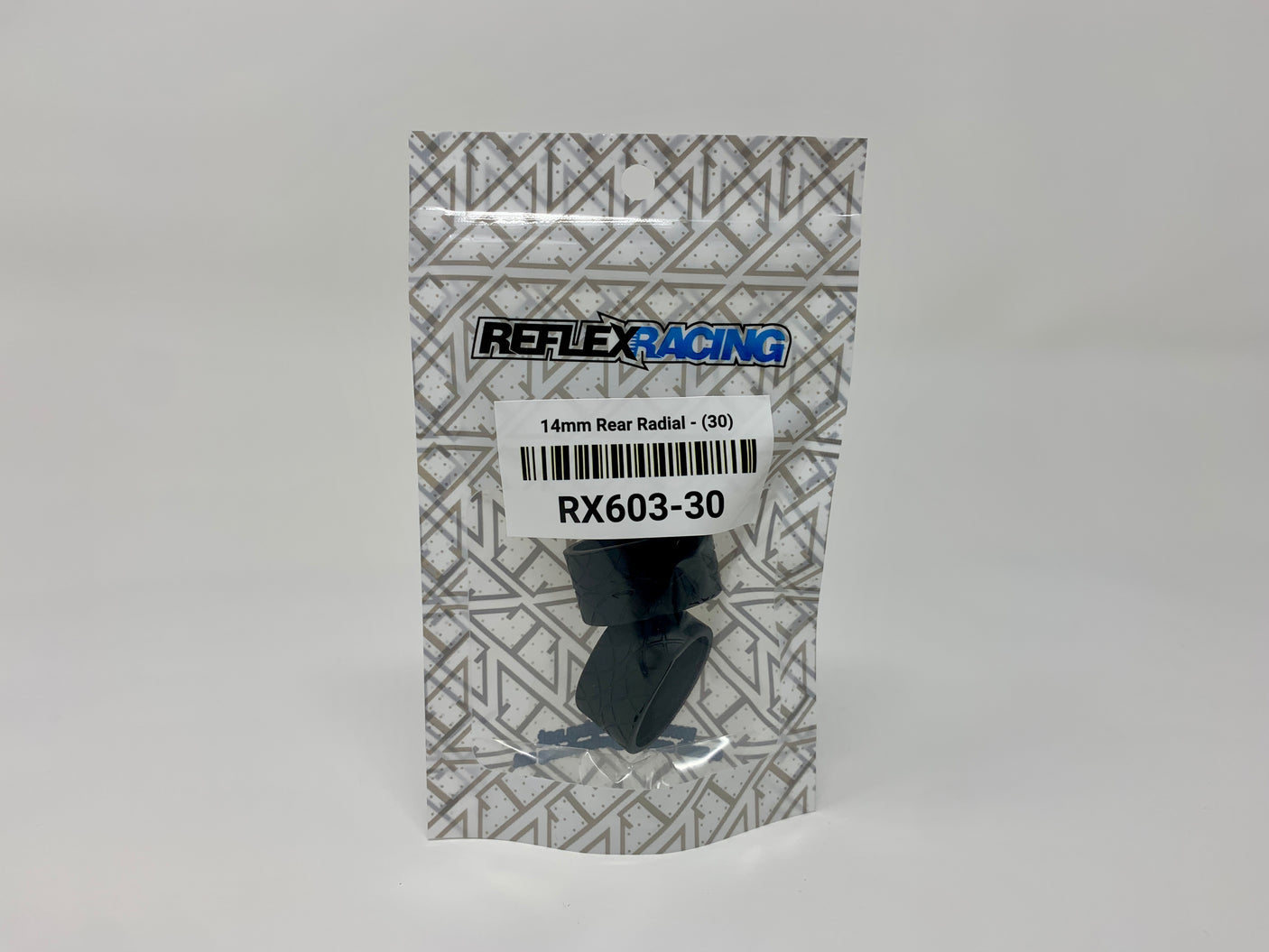 Reflex Racing RX603-30 14mm Radial Tire with 30° tread angle for RC cars, showing textured rubber surface and sidewall details.