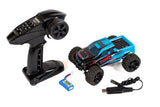 Rage RC Mini Trek MT 1/24 scale remote control monster truck on a dirt track, showcasing rugged design and off-road tires.